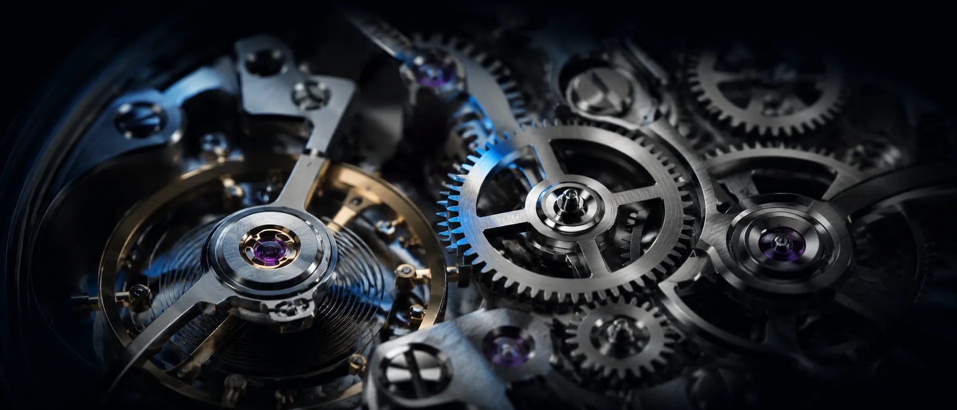 Macro of interlocking steel watch gears with one blue-lit gear at the centre