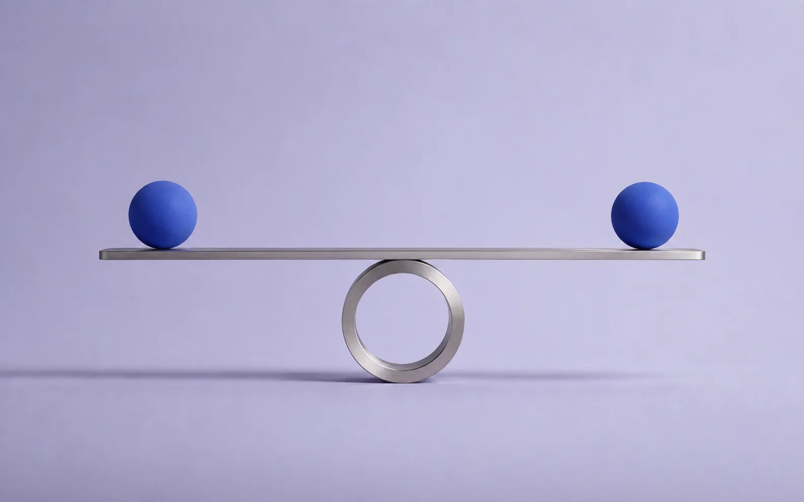 A silver beam resting on a ring, two blue spheres in perfect balance